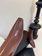 YSL 26S KNEE-HIGH HEELED BOOTS IN BROWN SHINY CALFSKIN