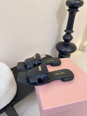 MIUMIU 26S FLAT SLIPPERS IN BLACK CALFSKIN