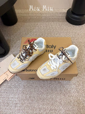 MIUMIU 26S PERFORATED SNEAKERS IN WHITE AND BEIGE YELLOW CALFSKIN