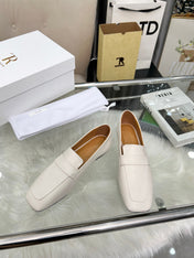 THE ROW 26S PENNY LOAFER FLATS IN IVORY WHITE GRAINED CALFSKIN