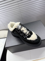 CHANEL 25S SNEAKERS WITH FUR ACCENTS 35MM IN BLACK CALFSKIN