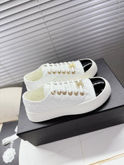 CHANEL 25S TRAINERS WHITE AND BLACK 35MM IN CALFSKIN