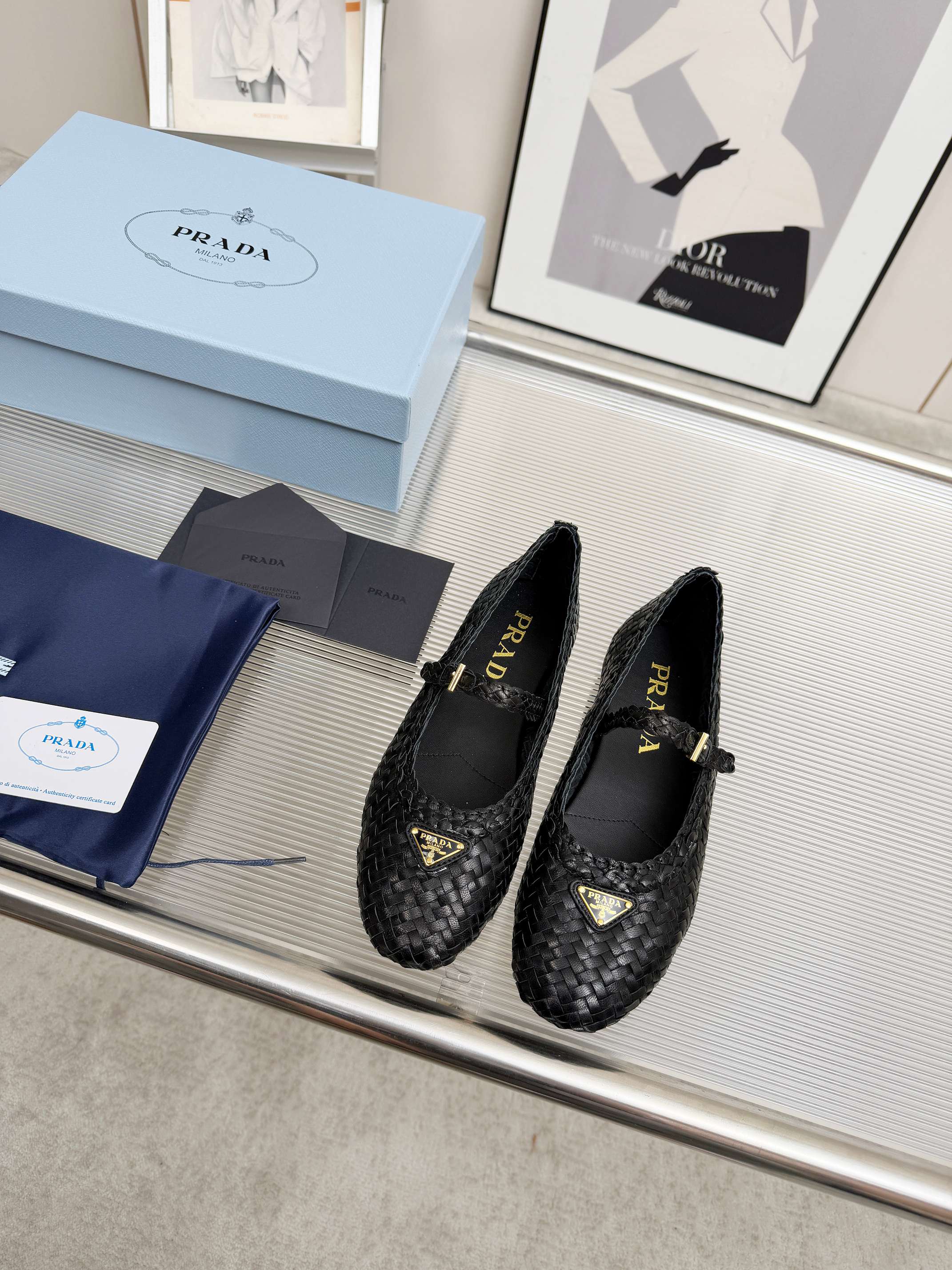 PRADA 26S MARY JANE FLATS IN BLACK WOVEN CALFSKIN
