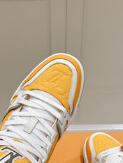 LV TRAINER SNEAKER IN SAFFRAN YELLOW GRAINED CALFSKIN