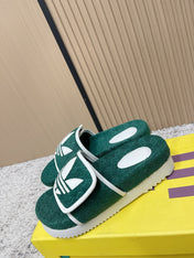 GUCCI 26S PLATFORM SLIDE SANDALS IN GREEN FABRIC
