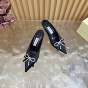 JIMMY CHOO 26S HIGH-HEELED MULES 65 MM IN BLACK SATIN WITH RHINESTONE BOW