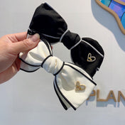 BOW HAIRPIN IN WHITE AND BLACK TRIM COTTON 406023