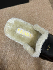 PRADA 26S SHEARLING MULE SLIPPERS IN BLACK CALFSKIN