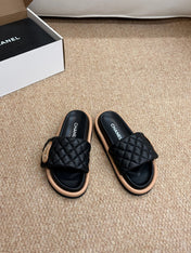 CHANEL 26S SLIDE SANDALS IN BLACK QUILTED CALFSKIN WITH LOGO PLAQUE