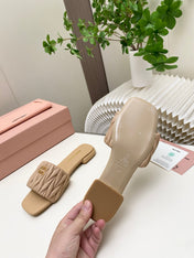 MIUMIU 26S MATELASSE SLIDES IN BEIGE CALFSKIN