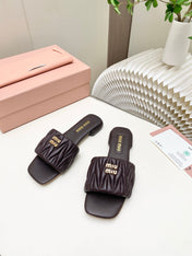 MIUMIU 26S MATELASSE SLIDES IN DARK BROWN CALFSKIN