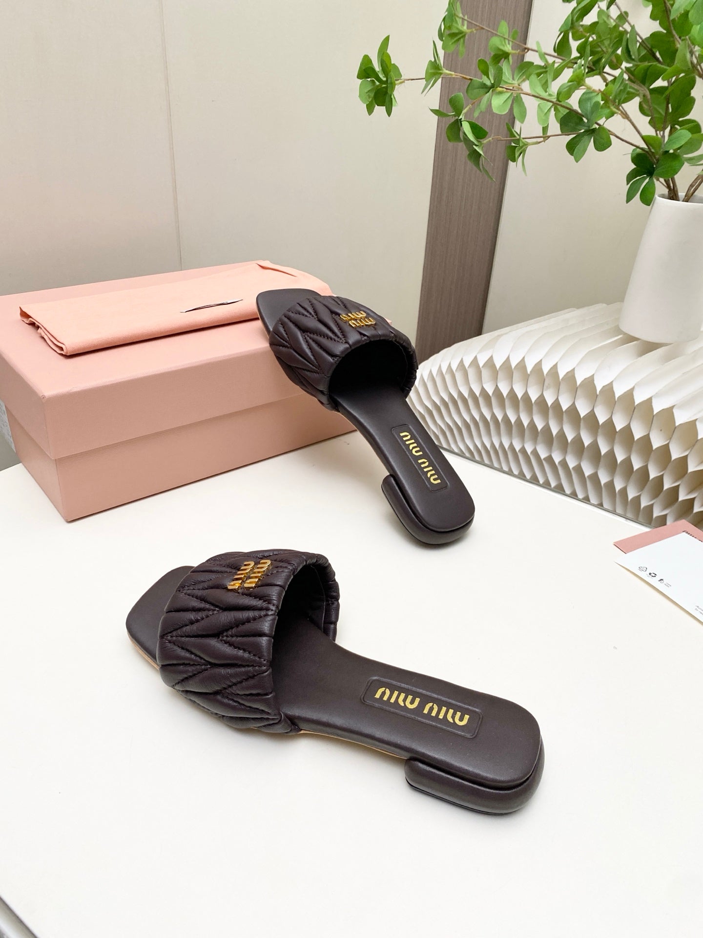 MIUMIU 26S MATELASSE SLIDES IN DARK BROWN CALFSKIN