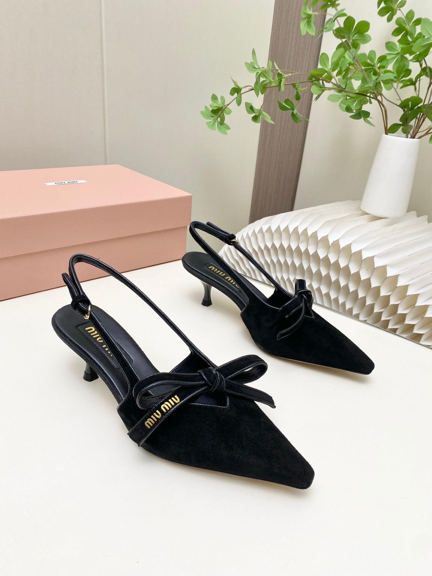 MIUMIU 26S SLINGBACK PUMPS 55MM IN BLACK SUEDE WITH BOW