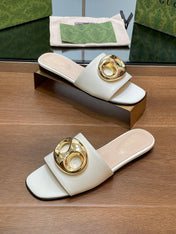 FLAT MULE IN WHITE CALFSKIN WITH GOLD HARDWARE