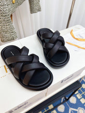 THE ROW 26S CROSSED PADDED SLIDES IN BLACK CALFSKIN