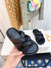 THE ROW 26S CROSSED PADDED SLIDES IN BLACK CALFSKIN