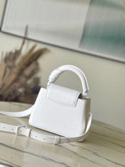 CAPUCINES EAST-WEST MINI 21 IN WHITE TAURILLON
