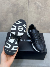 CHANEL 26S RUNNER CC LOGO SNEAKERS IN BLACK CALFSKIN