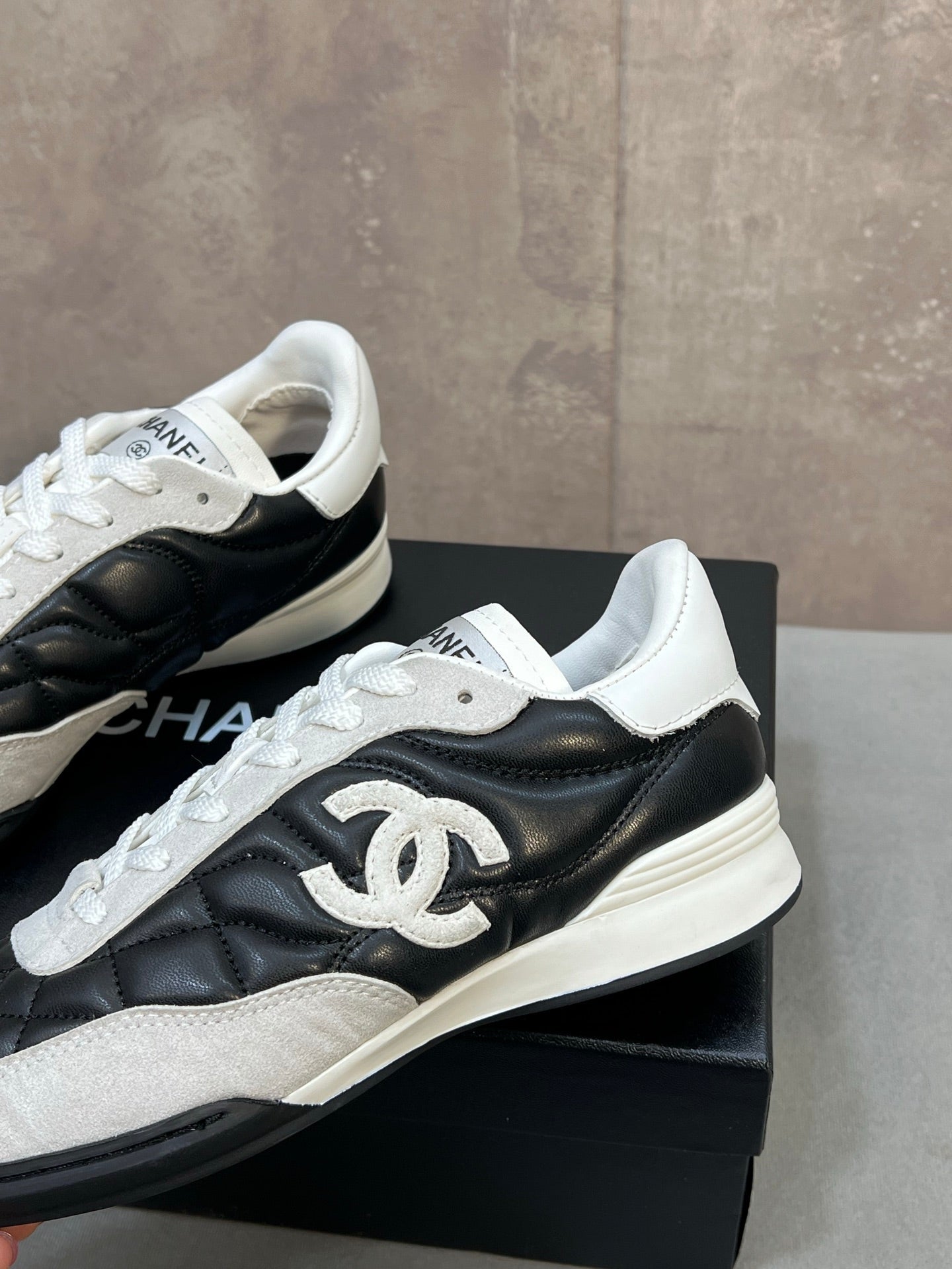 CHANEL 26S SNEAKERS IN BLACK AND WHITE QUILTED CALFSKIN CC LOGO
