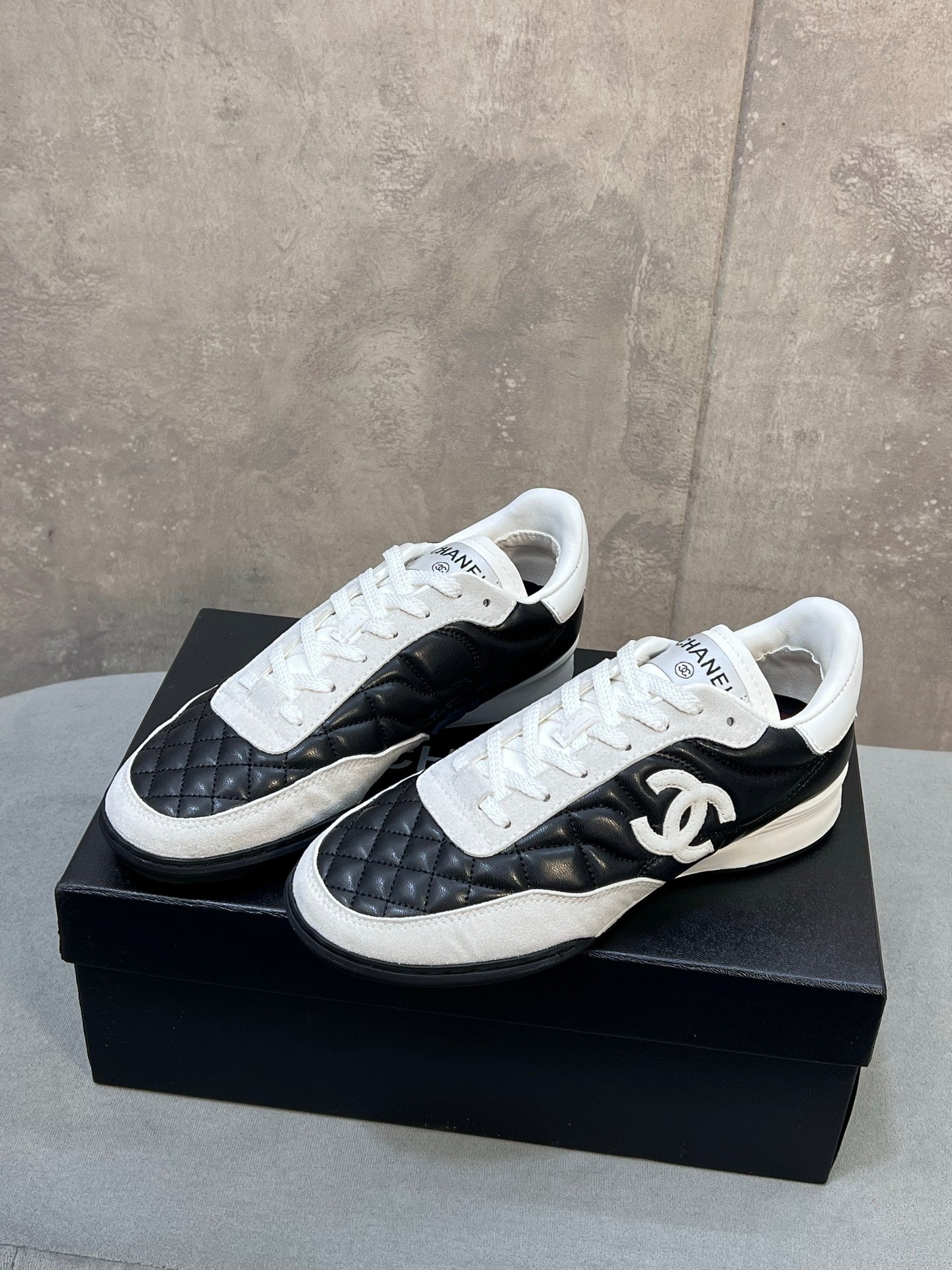 CHANEL 26S SNEAKERS IN BLACK AND WHITE QUILTED CALFSKIN CC LOGO