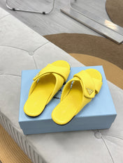 PRADA 25S SLIDE SANDALS IN YELLOW CALFSKIN LOGO