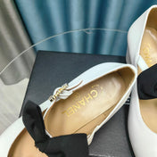 HIGH MARY JANE SHOES WHITE SHEEPSKIN WITH BLACK BOW