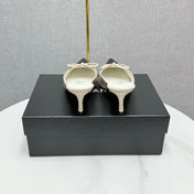 CC HEEL MULES 25S IN BLACK AND CREAM WHITE LAMBSKIN WITH BOW