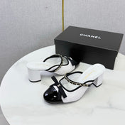 CHANEL 26S HIGH HEEL MULES 45 MM IN WHITE AND BLACK LAMBSKIN