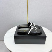 CHANEL 26S ICONIC CC SLIDES IN BLACK LAMBSKIN