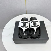 CHANEL 26S CC THONG SLIDES IN WHITE AND BLACK LAMBSKIN