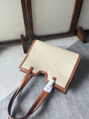 CABAS 37 IN WHITE CANVAS AND BRONZE BROWN CALFSKIN TRIM GOLD LOCK