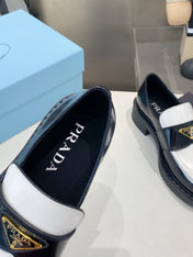 PRADA 26S LOAFERS IN BLACK AND WHITE CALFSKIN WITH LOGO