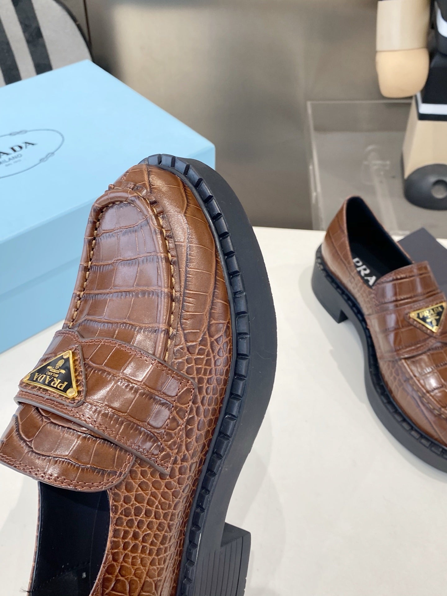 PRADA 26S LOAFERS IN DARK BROWN CROCODILE PRINT CALFSKIN