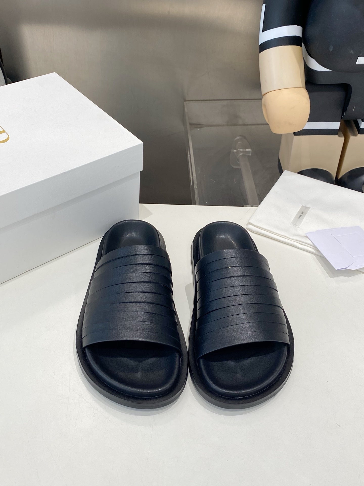 THE ROW 26S MULTI STRAP SLIDES IN BLACK CALFSKIN
