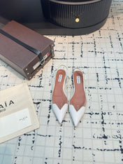 ALAIA FLAT SLINGBACK IN WHITE PATENT CALFSKIN AND FILM