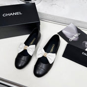CHANEL 25S MARY JANES IN BLACK CALFSKIN WITH WHITE BOW GOLD HARDWARE
