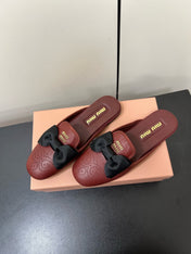 BOW MULES IN RED BROWN SHEEPSKIN