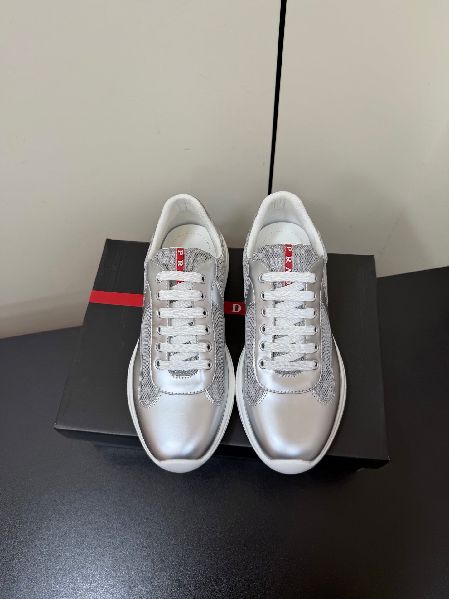 PRADA 26S SNEAKERS IN SILVER CALFSKIN AND WHITE MESH