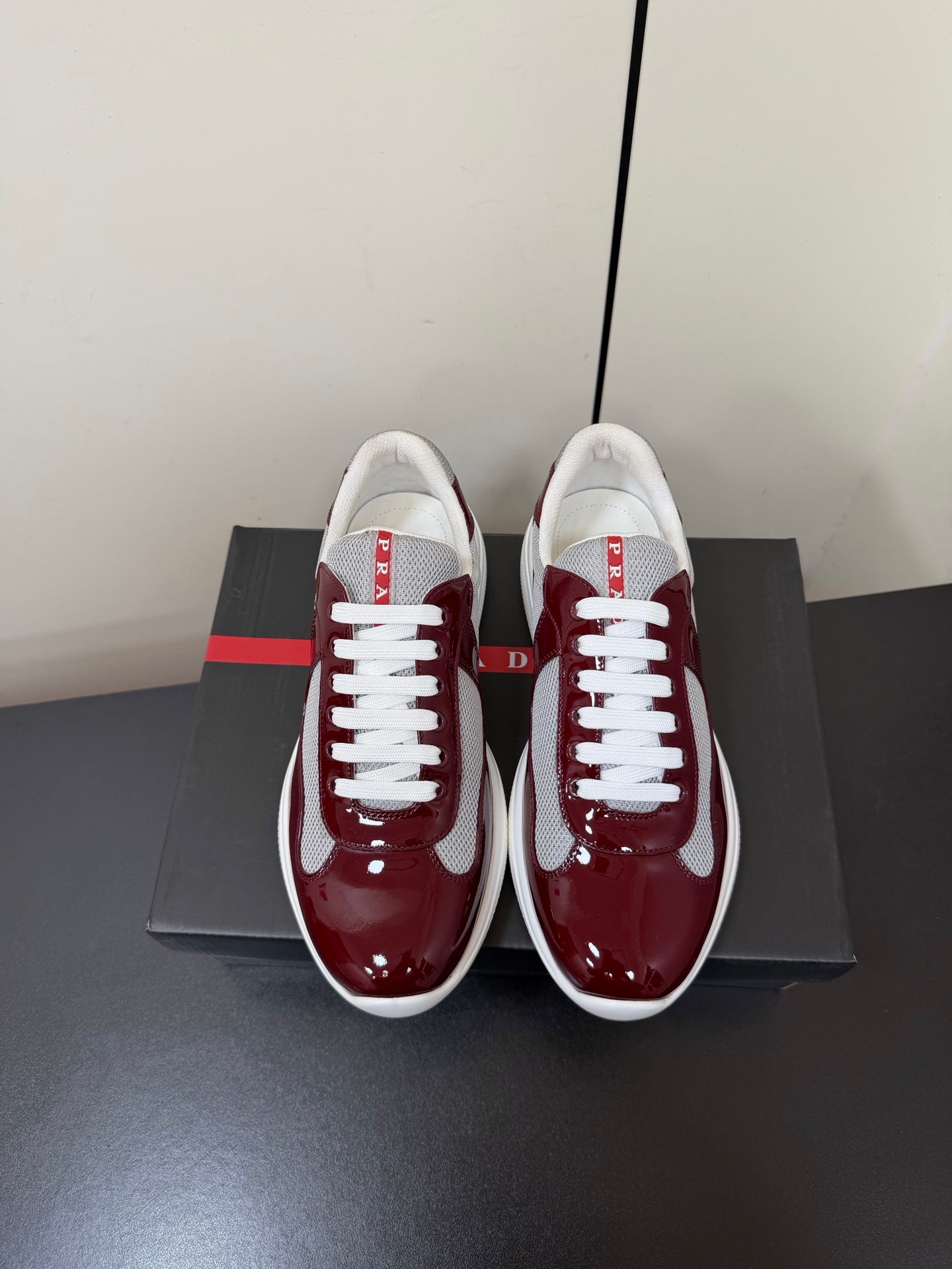 PRADA 26S SNEAKERS IN BURGUNDY RED PATENT CALFSKIN AND WHITE MESH