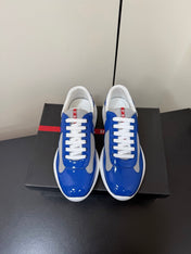 PRADA 26S SNEAKERS IN DARK BLUE PATENT CALFSKIN AND WHITE MESH
