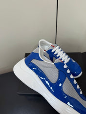 PRADA 26S SNEAKERS IN DARK BLUE PATENT CALFSKIN AND WHITE MESH