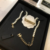 CHANEL 26S CHANEL LETTER CRYSTAL BAR PEARL NECKLACE IN GOLD METAL 631883
