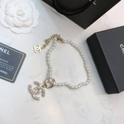 CHANEL 26S CHANEL CC LOGO PEARL BEADED NECKLACE WITH CHARM DETAIL IN GOLD METAL 633323