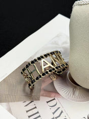 CHANEL 26S CHANEL LOGO OPEN CUFF LEATHER CHAIN BRACELET IN GOLD METAL 630836