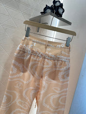 CHANEL BEIGE PRINTED DENIM PANTS