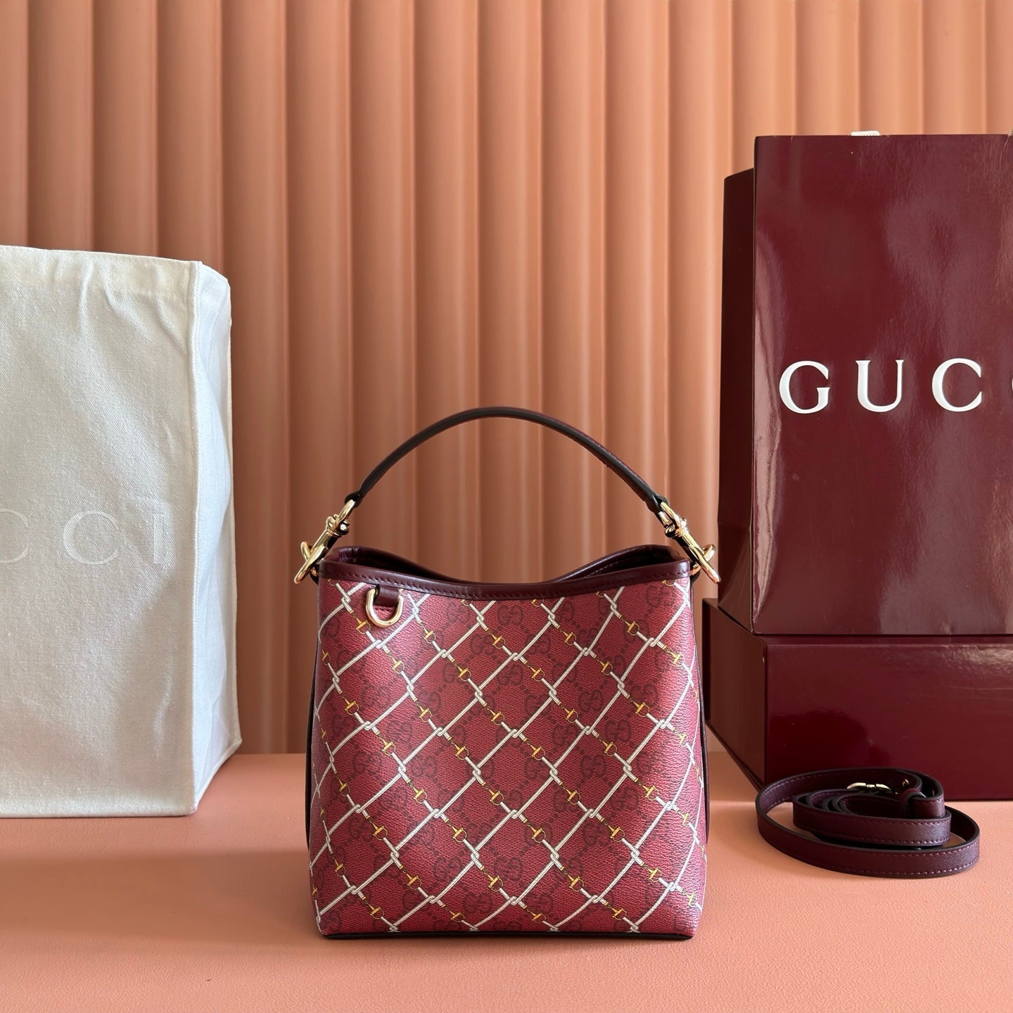 GUCCI 26S GG EMBLEM BUCKET BAG 19 IN DARK RED COATED FABRIC