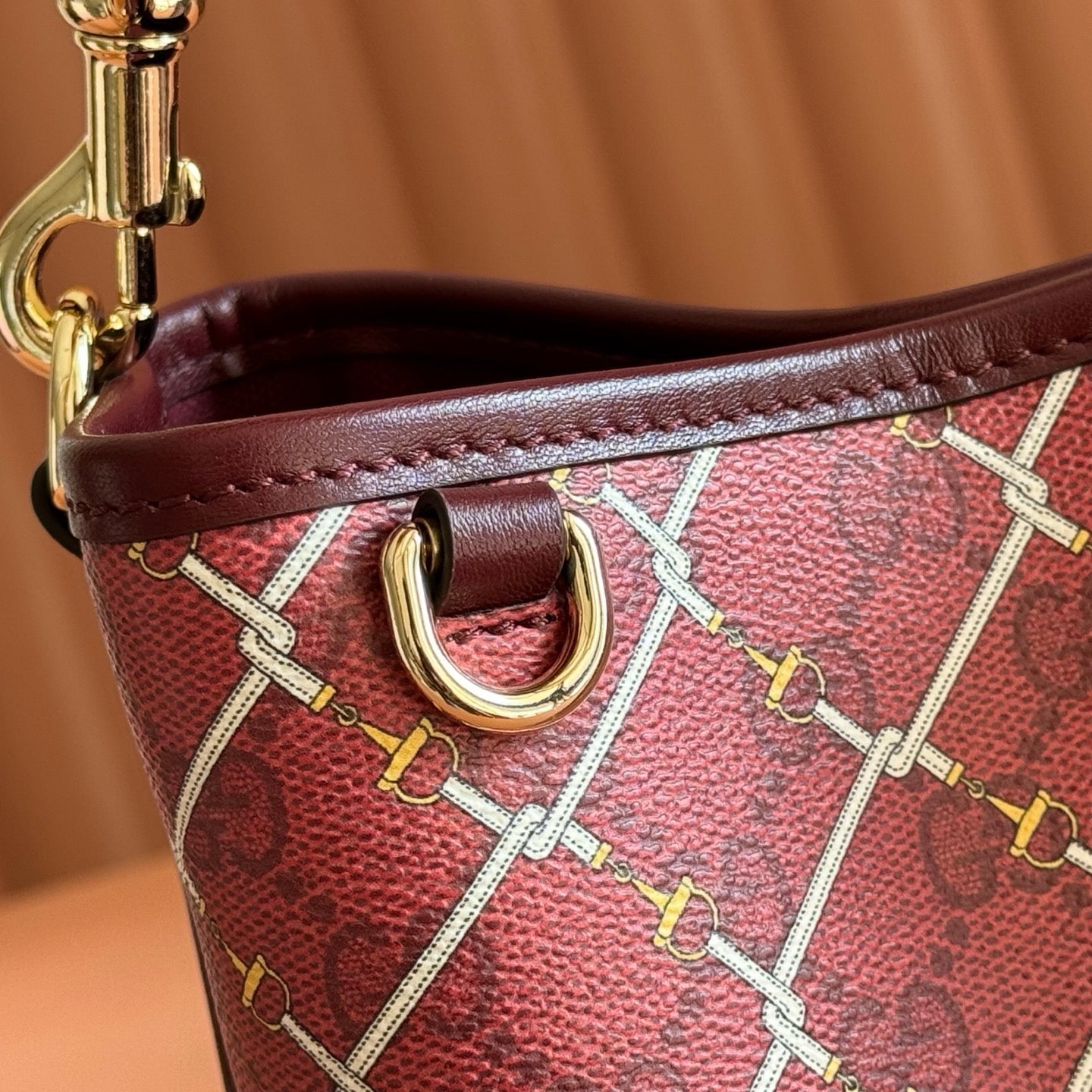 GUCCI 26S GG EMBLEM BUCKET BAG 19 IN DARK RED COATED FABRIC