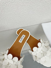 ALAIA FLAT MULE IN WHITE GLOSSY LAMBSKIN