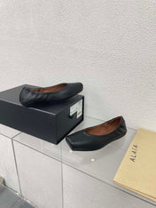 ALAIA BALLET FLATS IN BLACK CALFSKIN