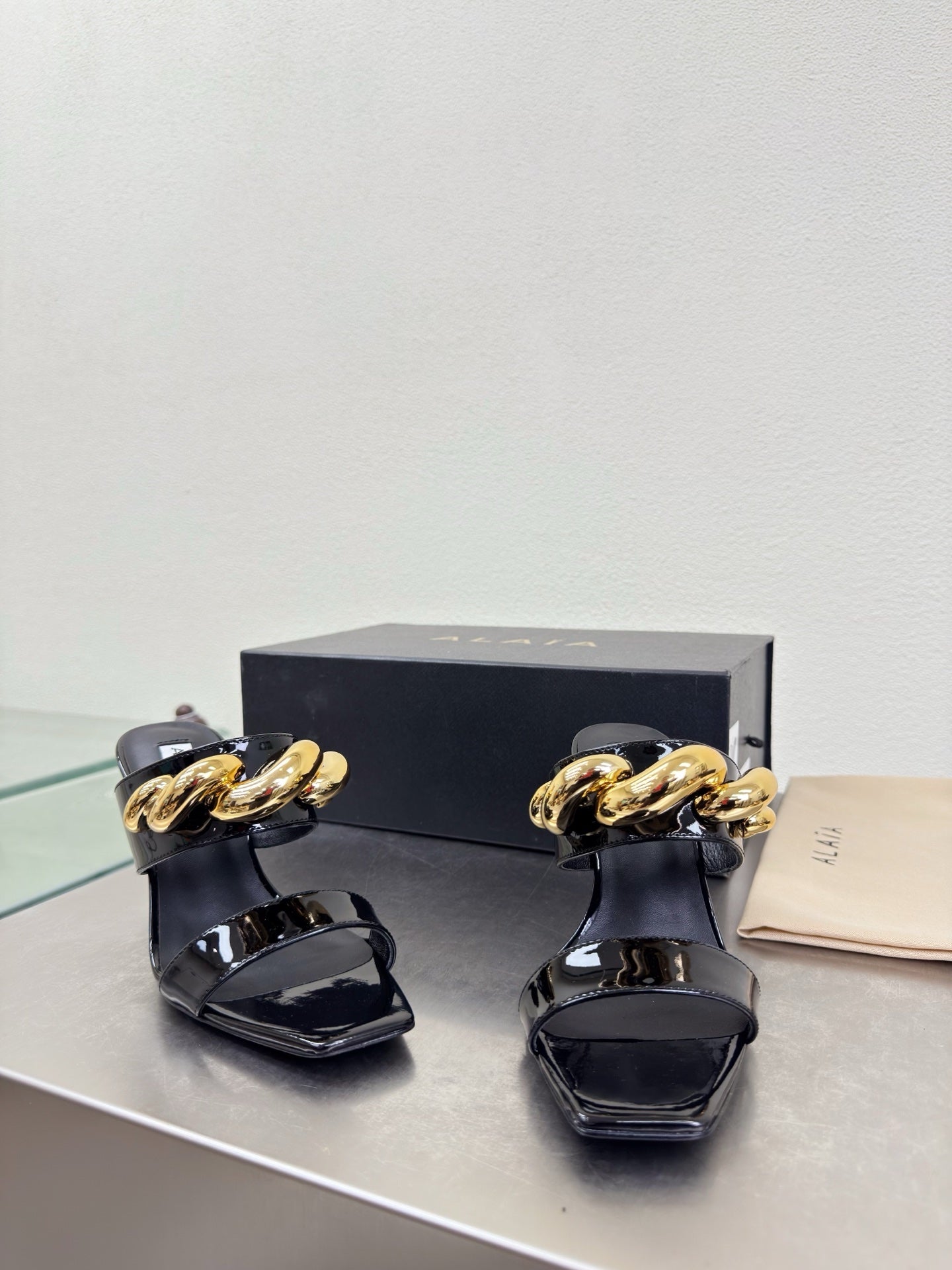 ALAIA 26S DOUBLE STRAP WEDGE SANDALS 110 MM IN BLACK GLOSSY CALFSKIN WITH GOLD HARDWARE